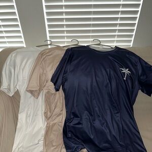 Navy, White, and Beige T-Shirts with Palm Tree Design